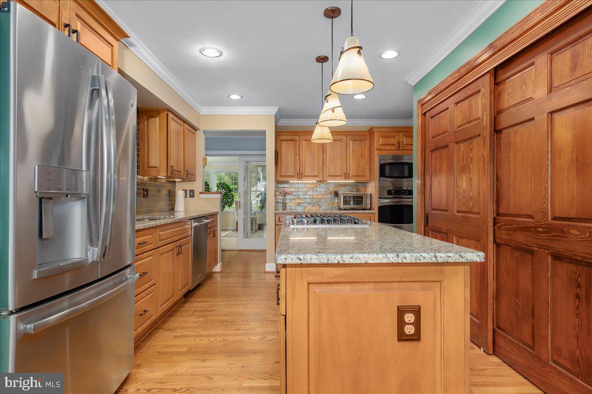 517 Valley View Road Towson, MD 21286 - Photo 44 of 89 a kitchen with stainless steel appliances granite countertop a refrigerator a oven a sink and a counter space