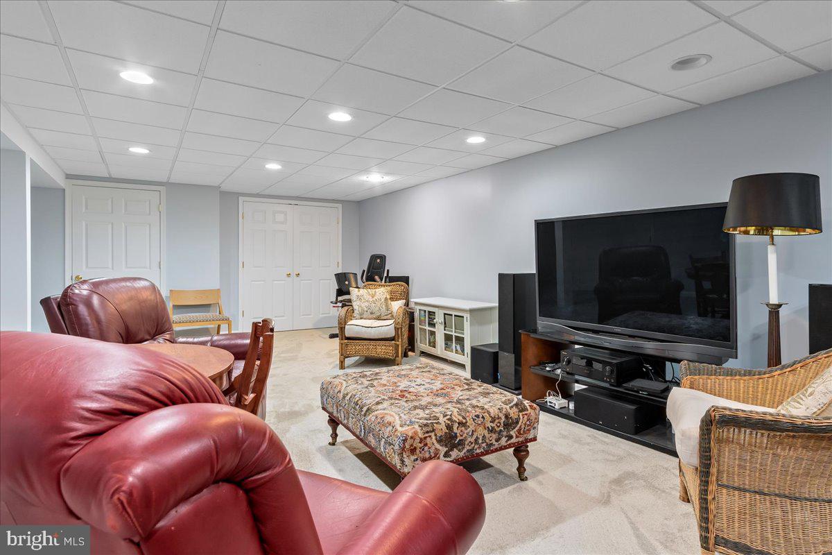 517 Valley View Road Towson, MD 21286 - Photo 64 of 89 a living room with furniture and a flat screen tv