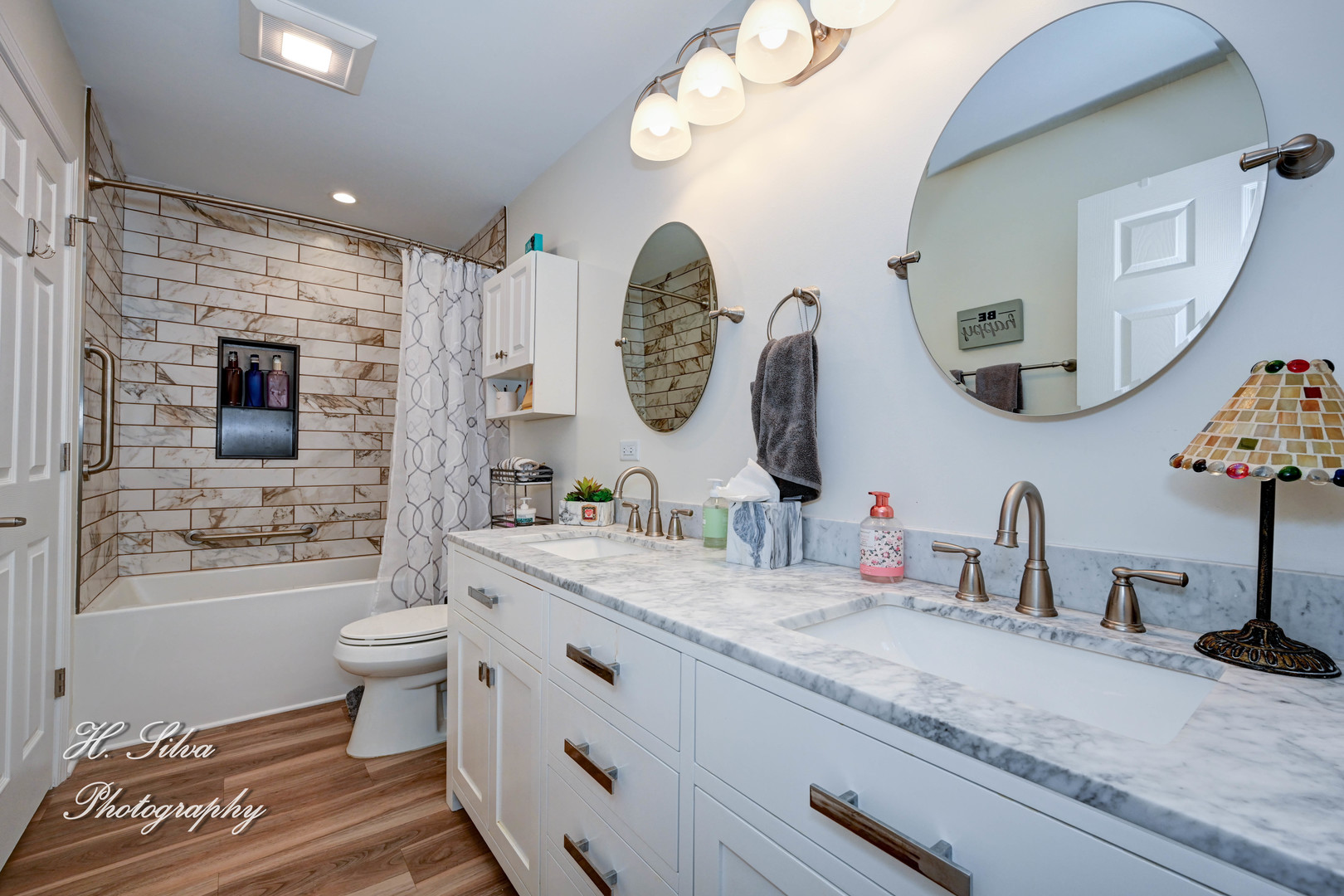 1109 Needham Road Naperville, IL 60563 - Photo 9 of 16 a bathroom with a granite countertop toilet sink and mirror