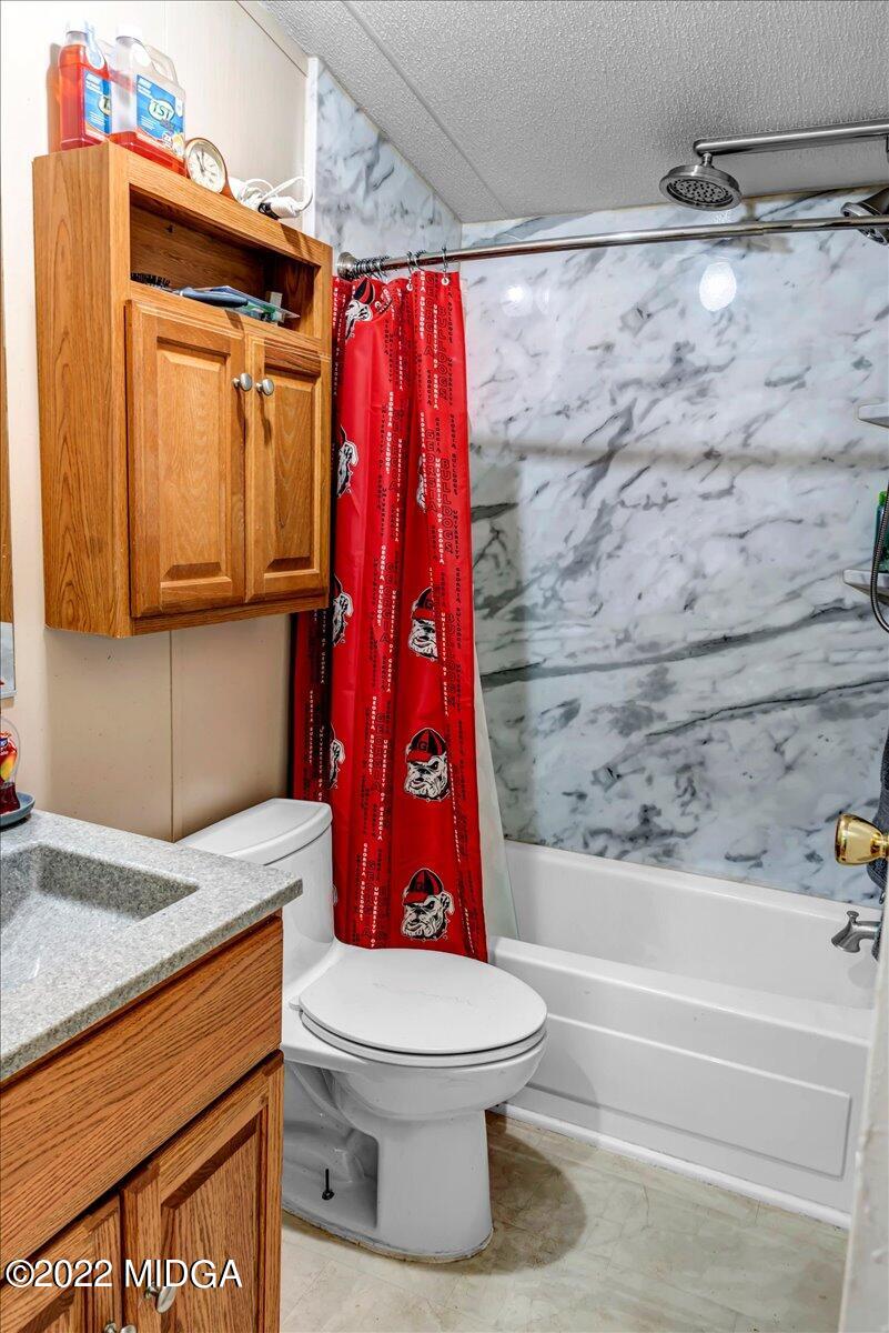 3401 Whitaker Road Roberta, GA 31078 - Photo 11 of 39 a bathroom with a toilet and a shower