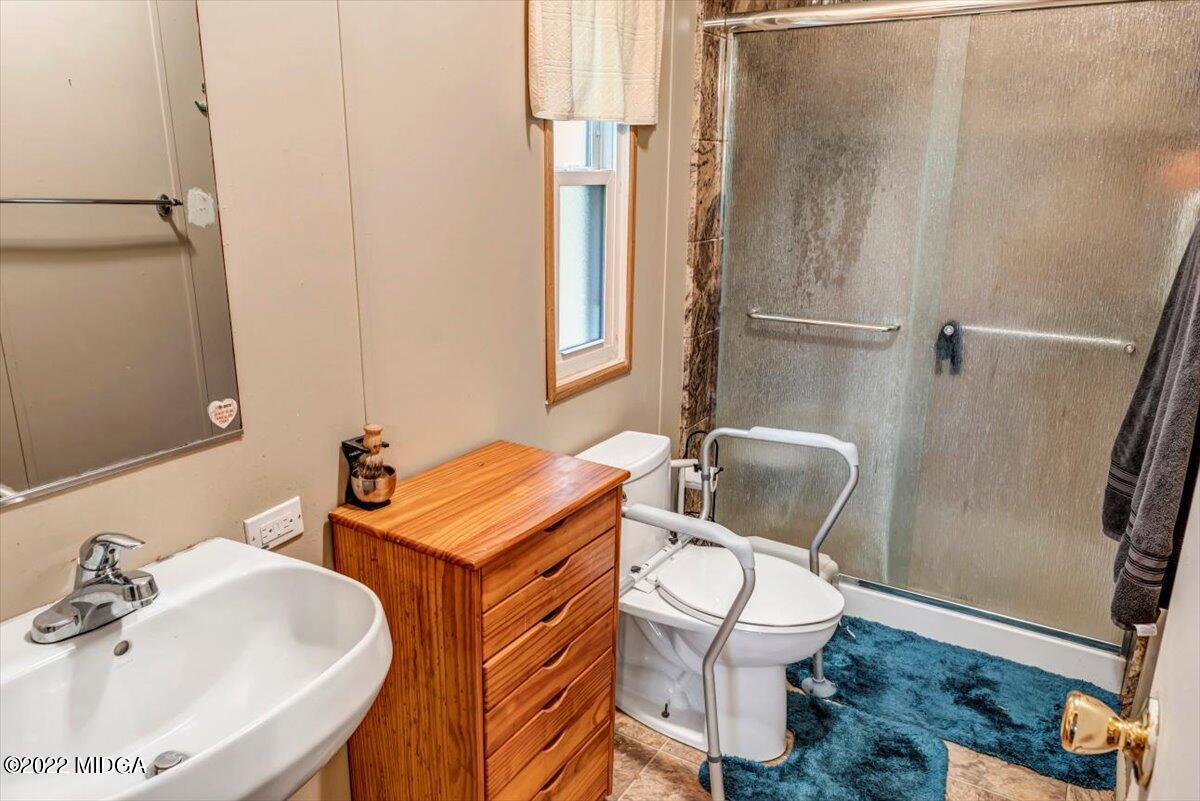 3401 Whitaker Road Roberta, GA 31078 - Photo 13 of 39 a bathroom with a sink toilet and shower