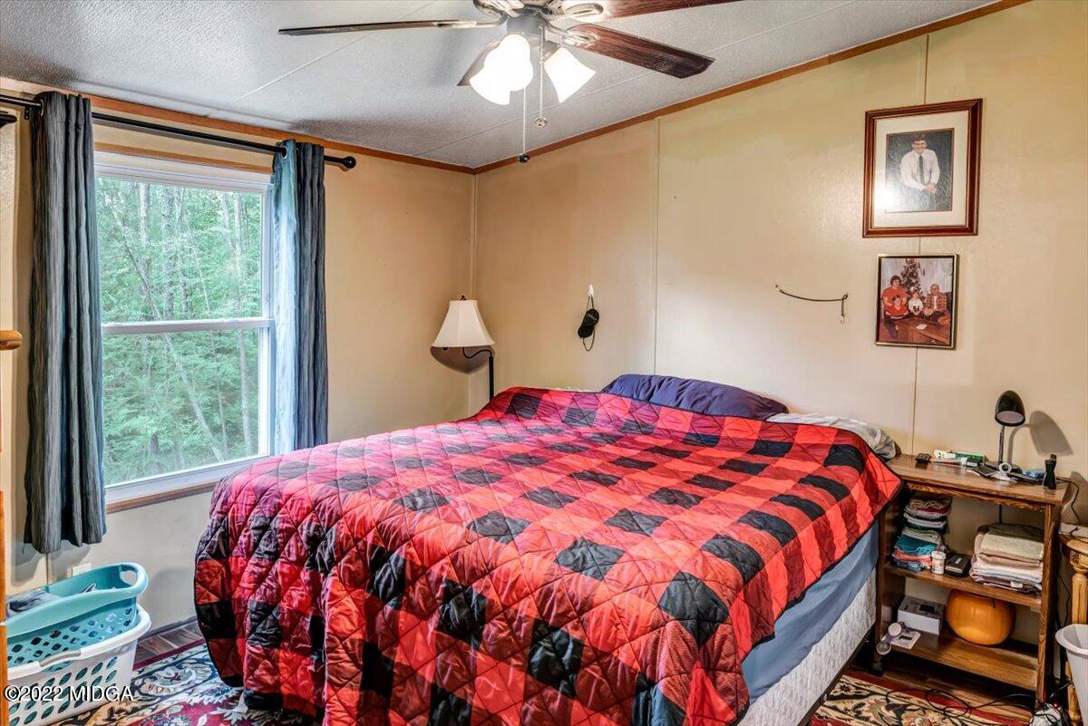 3401 Whitaker Road Roberta, GA 31078 - Photo 14 of 39 a bedroom with a bed and a window