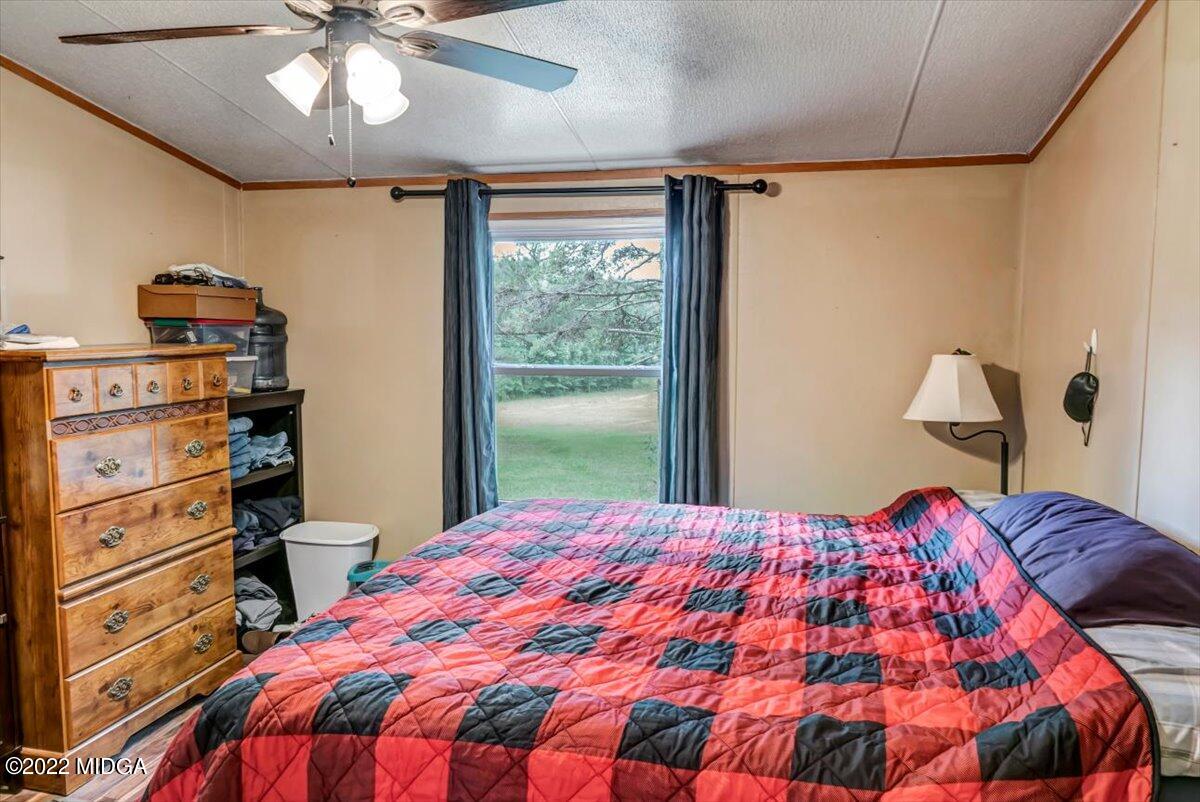 3401 Whitaker Road Roberta, GA 31078 - Photo 15 of 39 a bedroom with a bed and a dresser