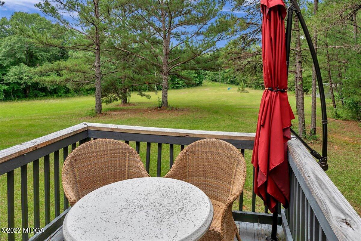 3401 Whitaker Road Roberta, GA 31078 - Photo 18 of 39 a view of balcony with two chairs and a table