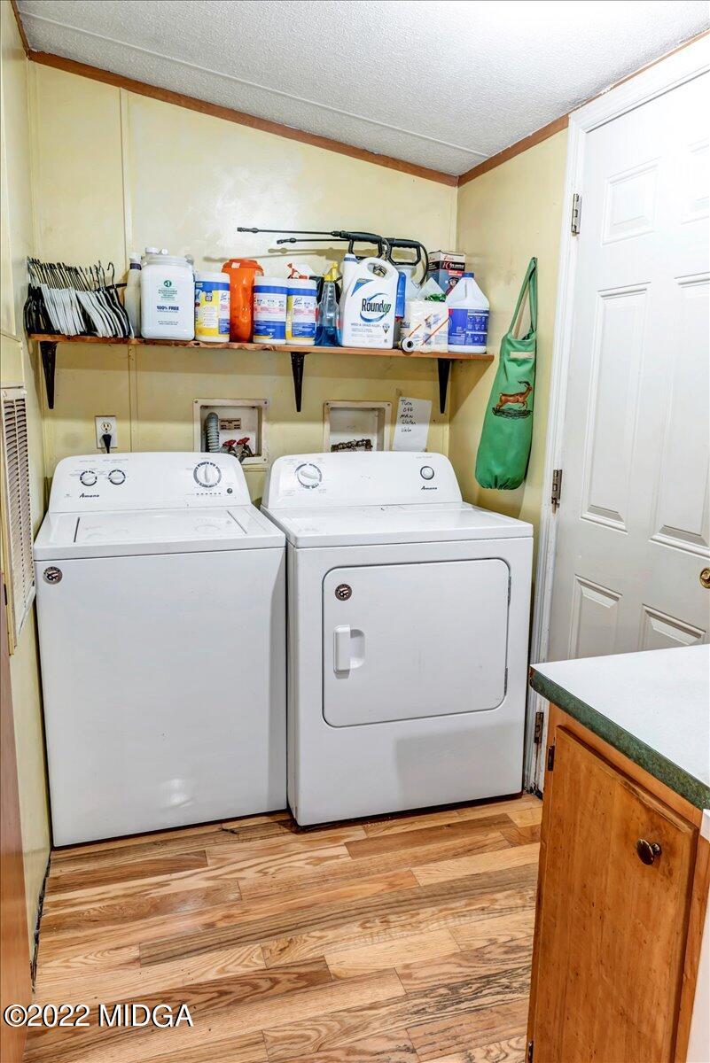 3401 Whitaker Road Roberta, GA 31078 - Photo 19 of 39 a view of storage and utility room with washer and dryer