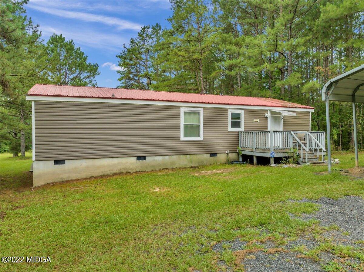 3401 Whitaker Road Roberta, GA 31078 - Photo 20 of 39 a view of a house with a backyard