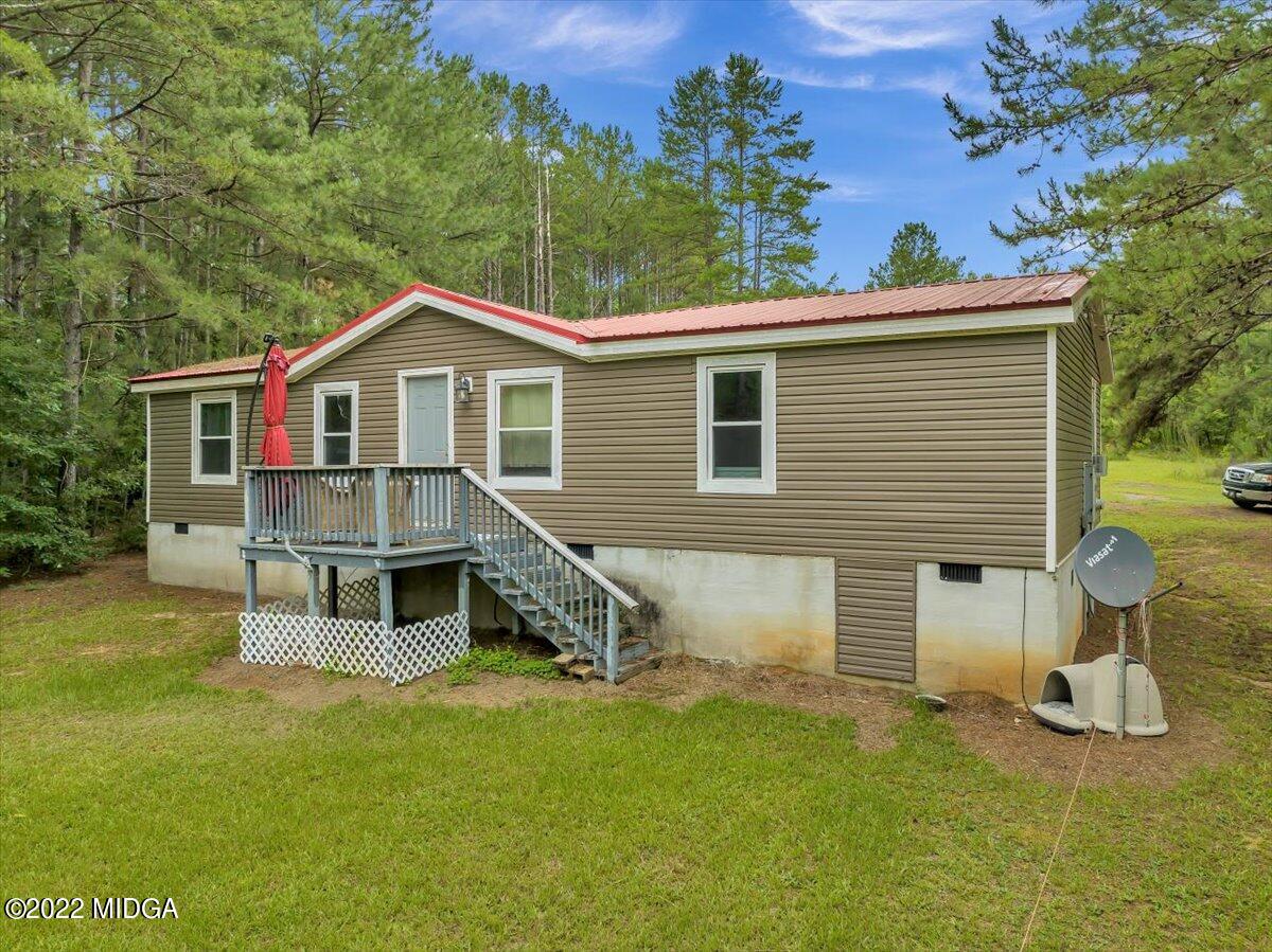 3401 Whitaker Road Roberta, GA 31078 - Photo 2 of 39 a view of a house with a backyard