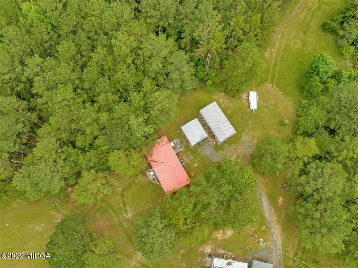 3401 Whitaker Road Roberta, GA 31078 - Photo 21 of 39 a view of a yard with plants and wooden fence