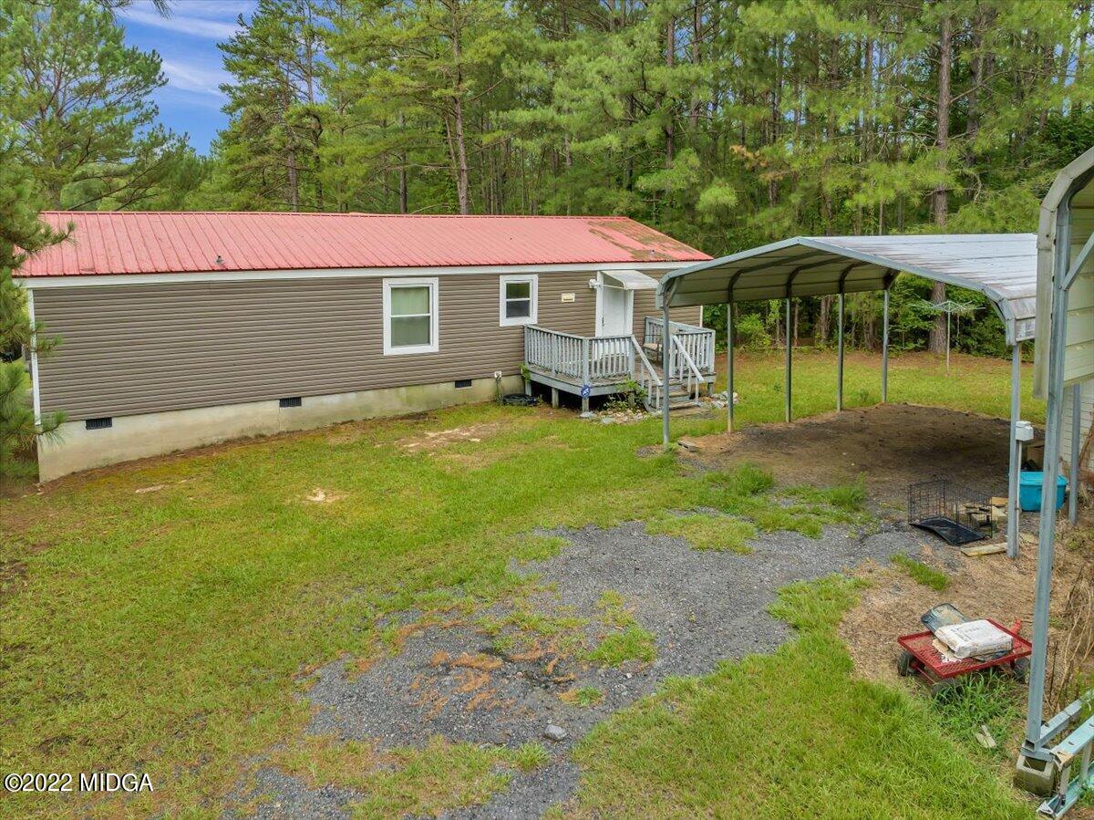 3401 Whitaker Road Roberta, GA 31078 - Photo 29 of 39 a front view of a house with garden