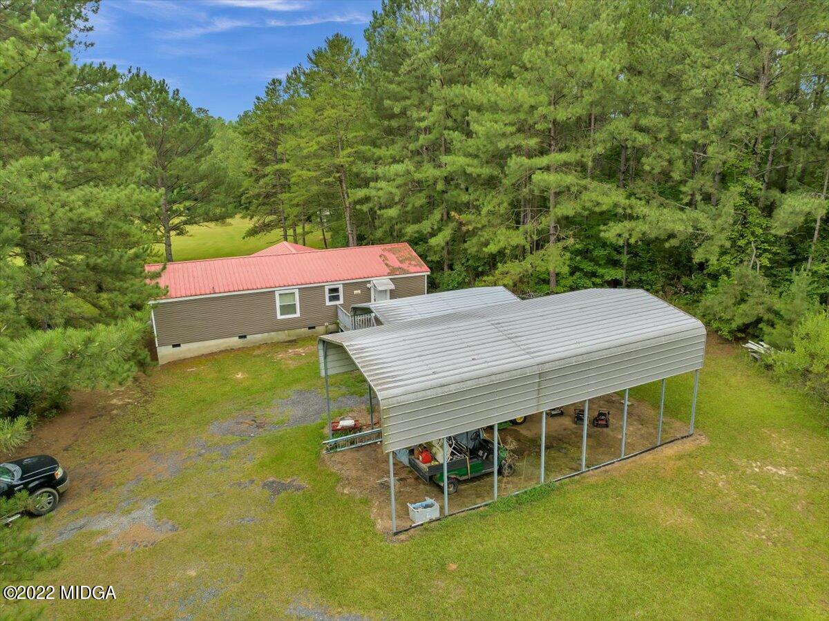 3401 Whitaker Road Roberta, GA 31078 - Photo 30 of 39 an aerial view of a house with a yard table and chairs