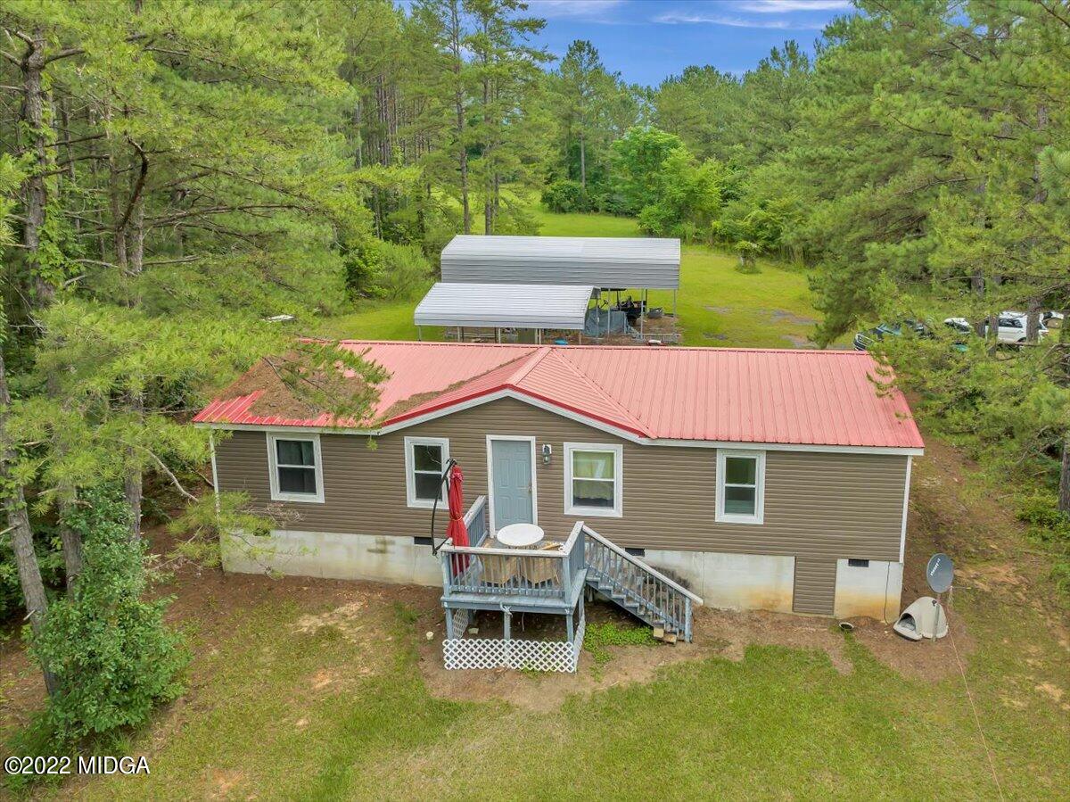 3401 Whitaker Road Roberta, GA 31078 - Photo 31 of 39 a backyard of a house with table and chairs