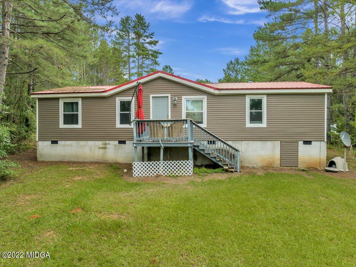 3401 Whitaker Road Roberta, GA 31078 - Photo 32 of 39 a view of a house with a yard and sitting area