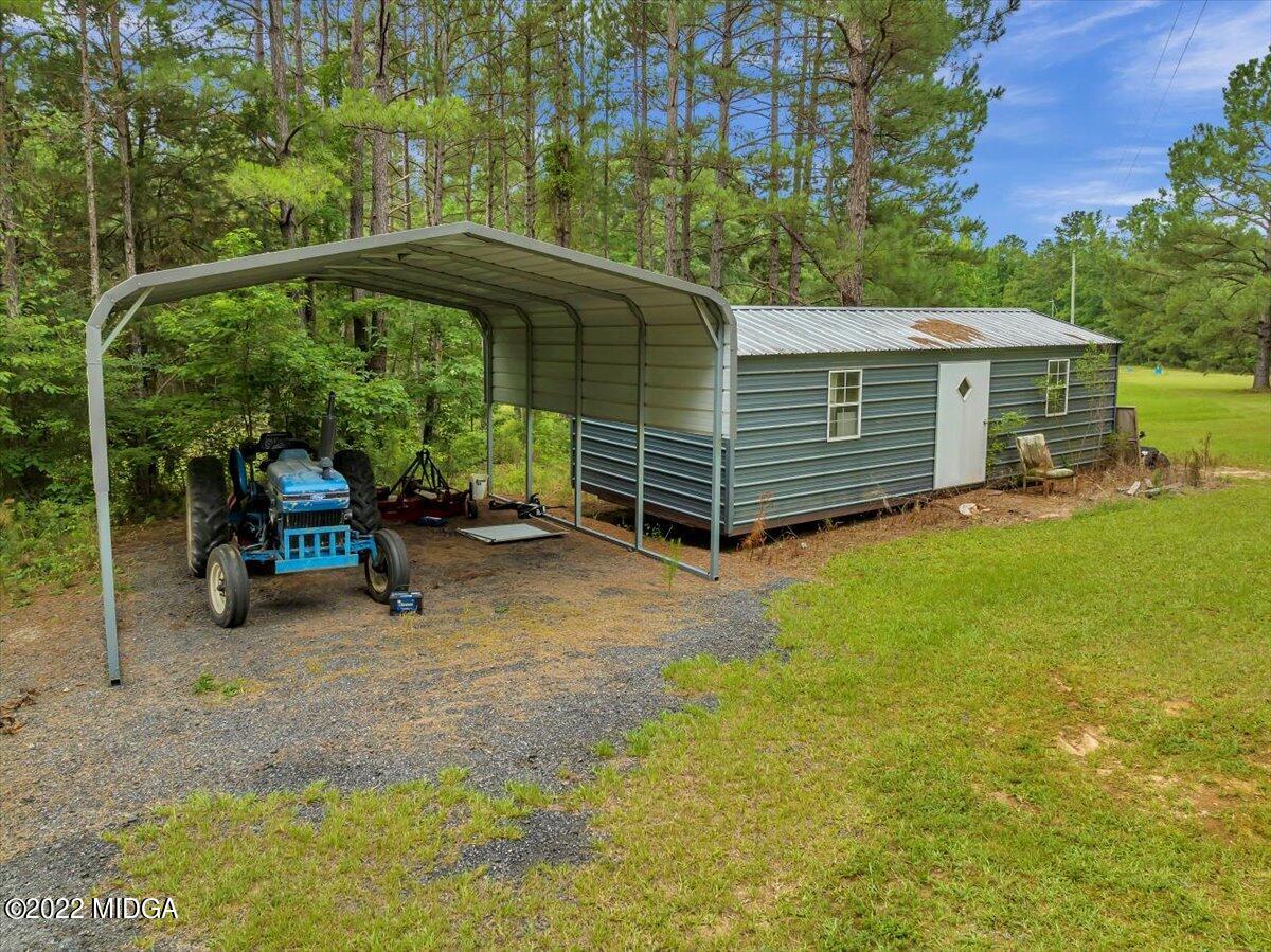 3401 Whitaker Road Roberta, GA 31078 - Photo 35 of 39 a view of a house with a yard and sitting area
