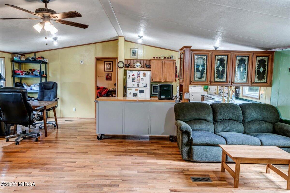 3401 Whitaker Road Roberta, GA 31078 - Photo 6 of 39 a living room with furniture and a wooden floor