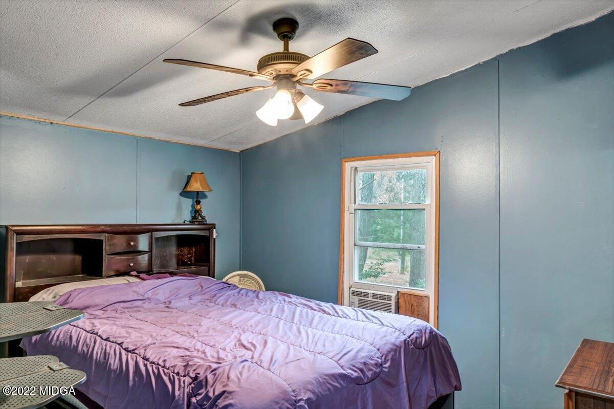 3401 Whitaker Road Roberta, GA 31078 - Photo 9 of 39 a bedroom with a bed and a window