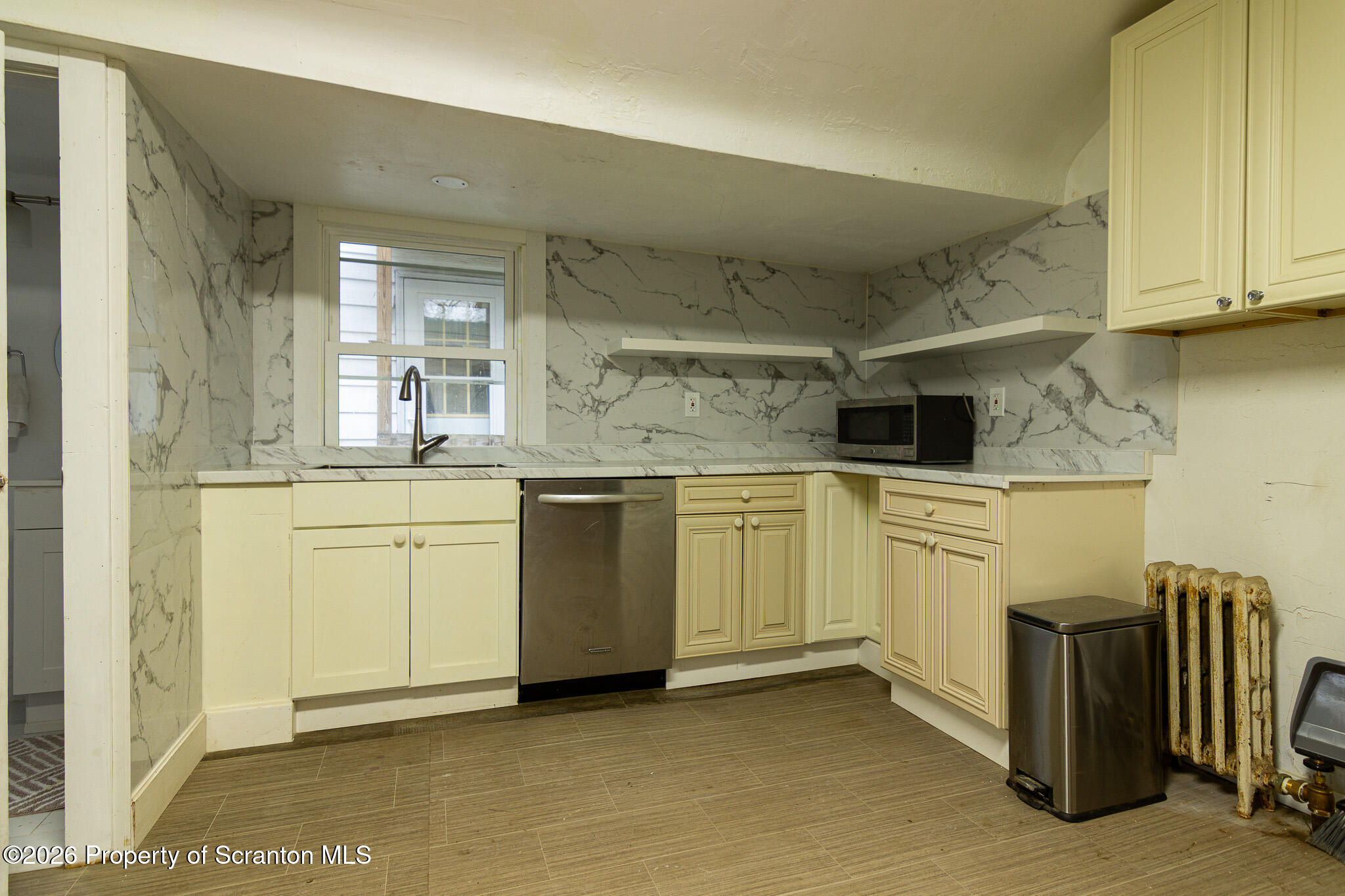 214 William Street Scranton, PA 18508 - Photo 8 of 33 a kitchen with a sink and cabinets
