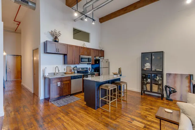 a workspace with furniture and a potted plant