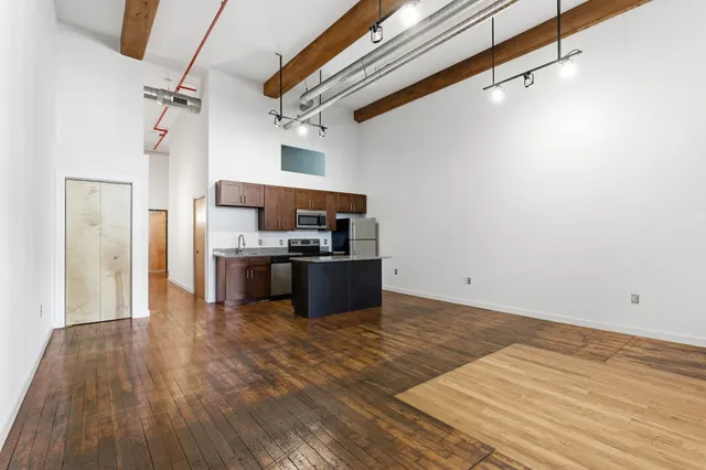 a bathroom with double sink and a mirror