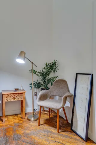a view of a patio with a table and chairs