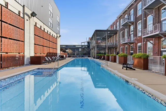 a view of a balcony with furniture and a potted plant