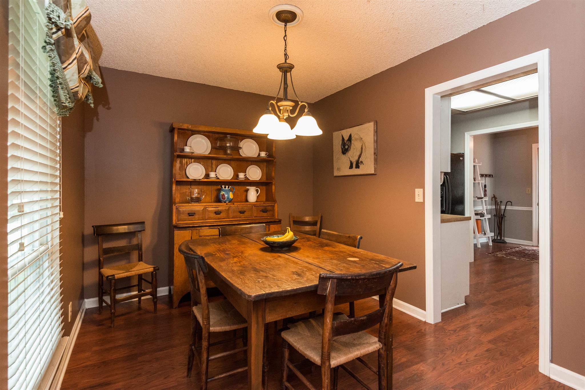 316 Cedarcliff Road Antioch, TN 37013 - Photo 12 of 27 a view of a dining room with furniture and wooden floor