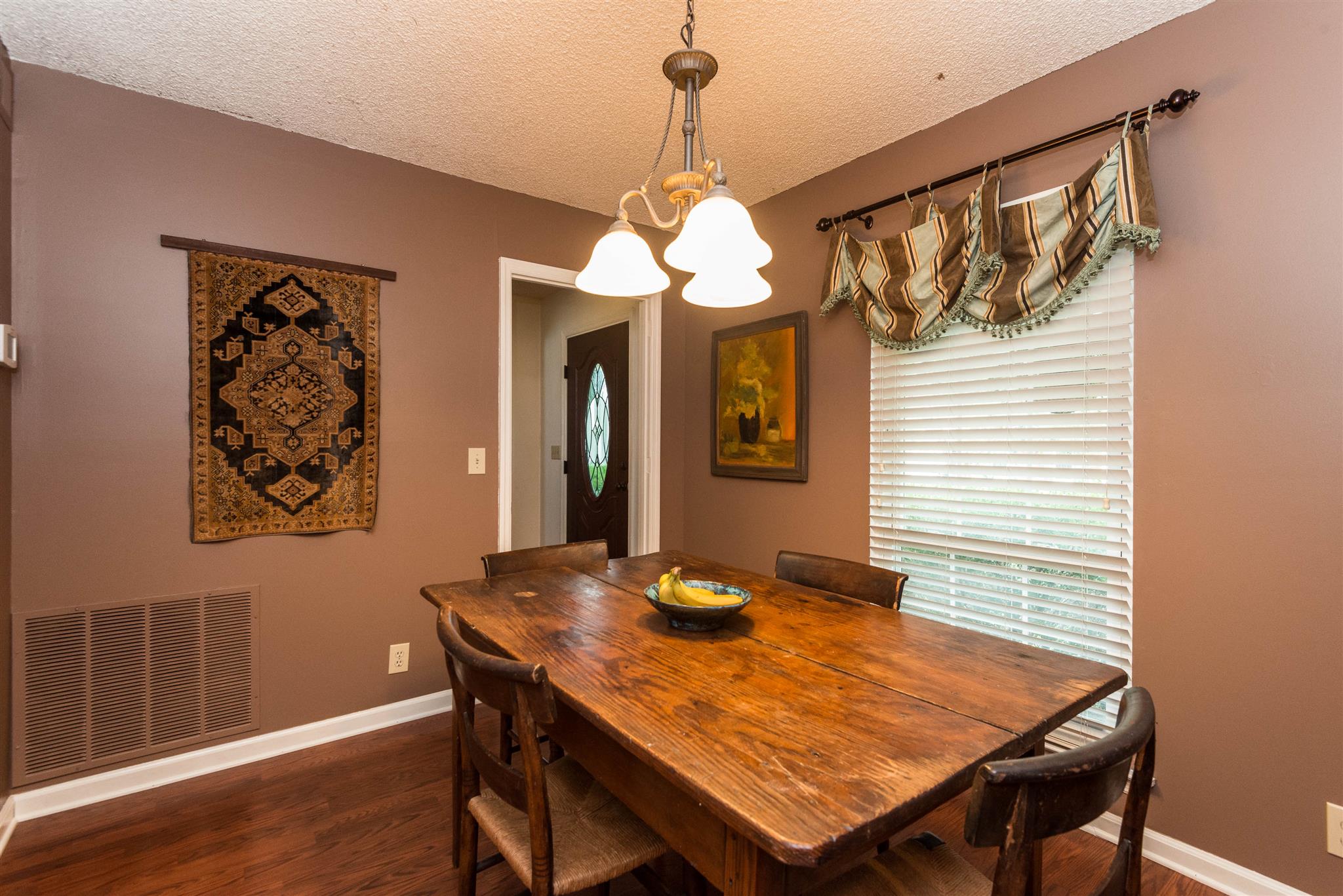 316 Cedarcliff Road Antioch, TN 37013 - Photo 13 of 27 a dining room with a table and chairs