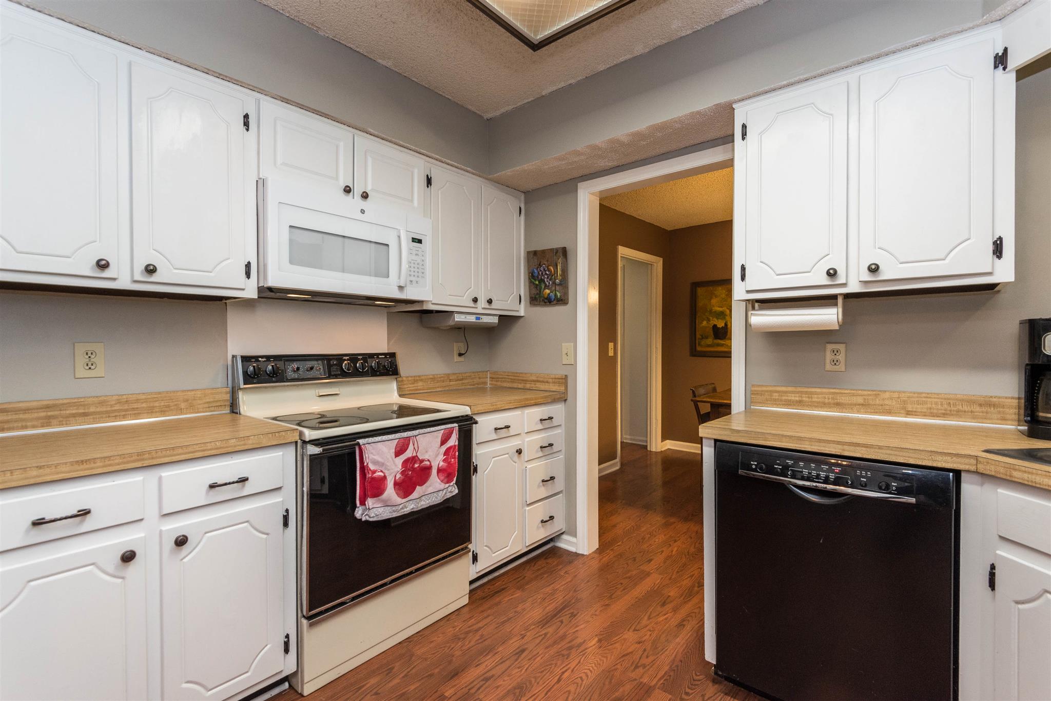 316 Cedarcliff Road Antioch, TN 37013 - Photo 15 of 27 a kitchen with granite countertop a stove and a refrigerator