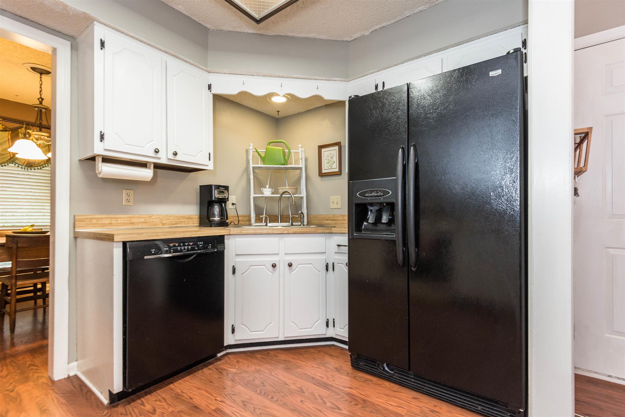 316 Cedarcliff Road Antioch, TN 37013 - Photo 16 of 27 a kitchen with stainless steel appliances granite countertop a refrigerator and a sink