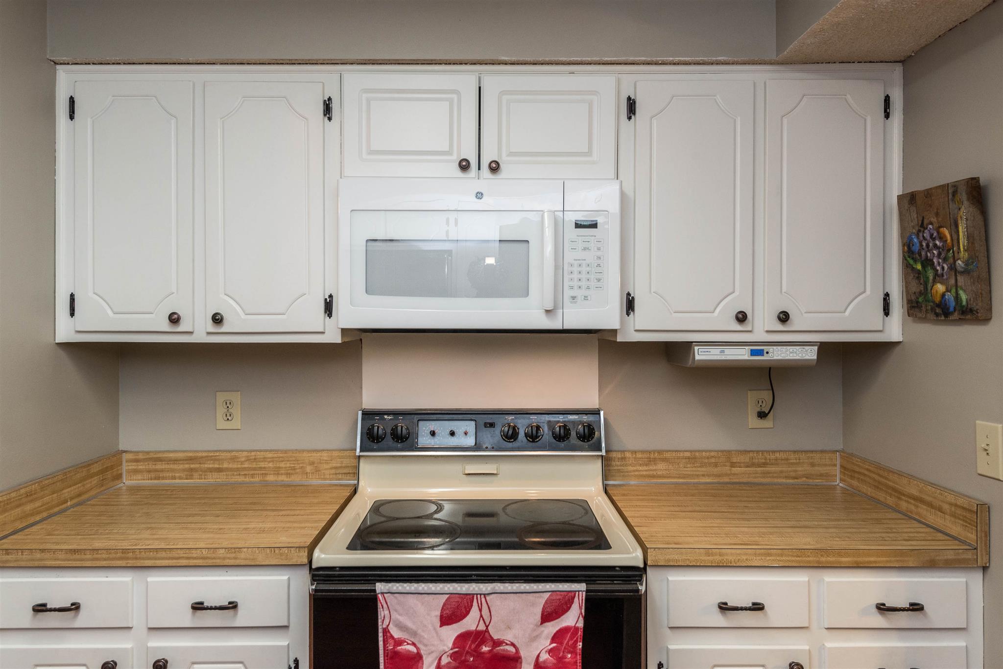 316 Cedarcliff Road Antioch, TN 37013 - Photo 17 of 27 a kitchen with granite countertop white cabinets and white appliances