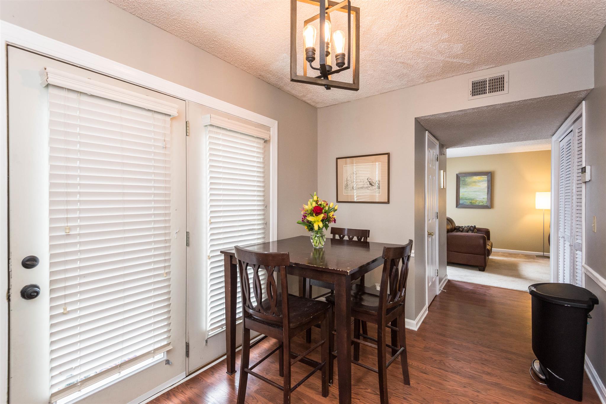 316 Cedarcliff Road Antioch, TN 37013 - Photo 18 of 27 a view of a dining room with furniture and wooden floor