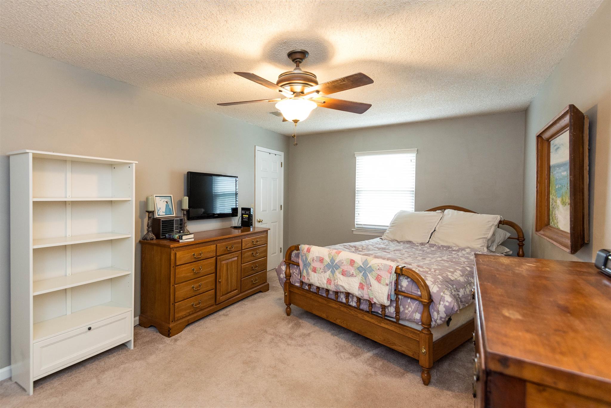 316 Cedarcliff Road Antioch, TN 37013 - Photo 25 of 27 a bedroom with a bed and a ceiling fan