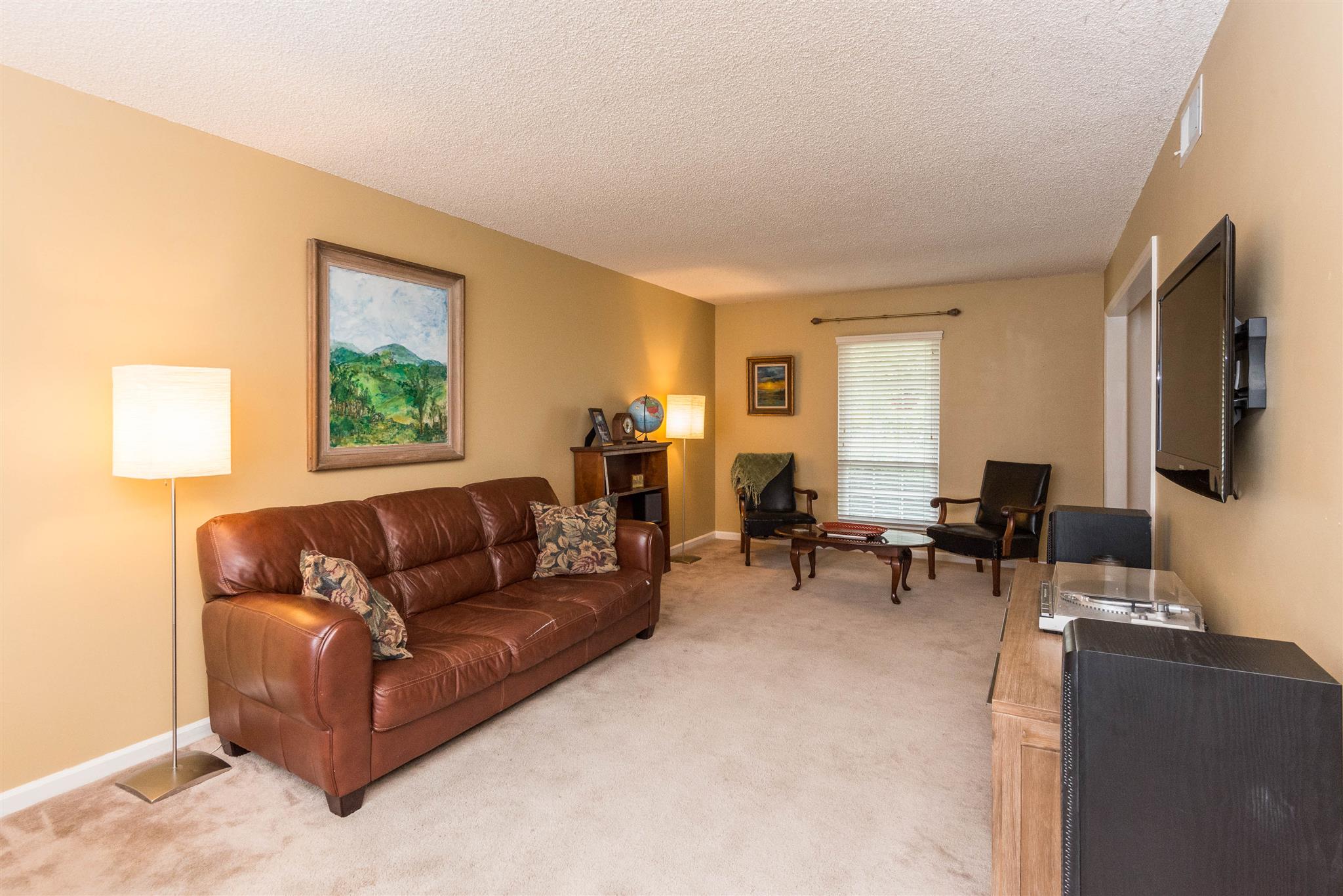 316 Cedarcliff Road Antioch, TN 37013 - Photo 10 of 27 a living room with furniture and a flat screen tv