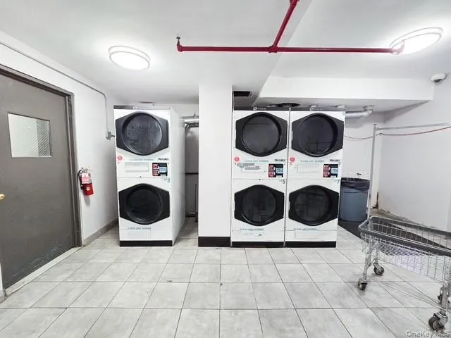 a kitchen with a stove a microwave and a sink