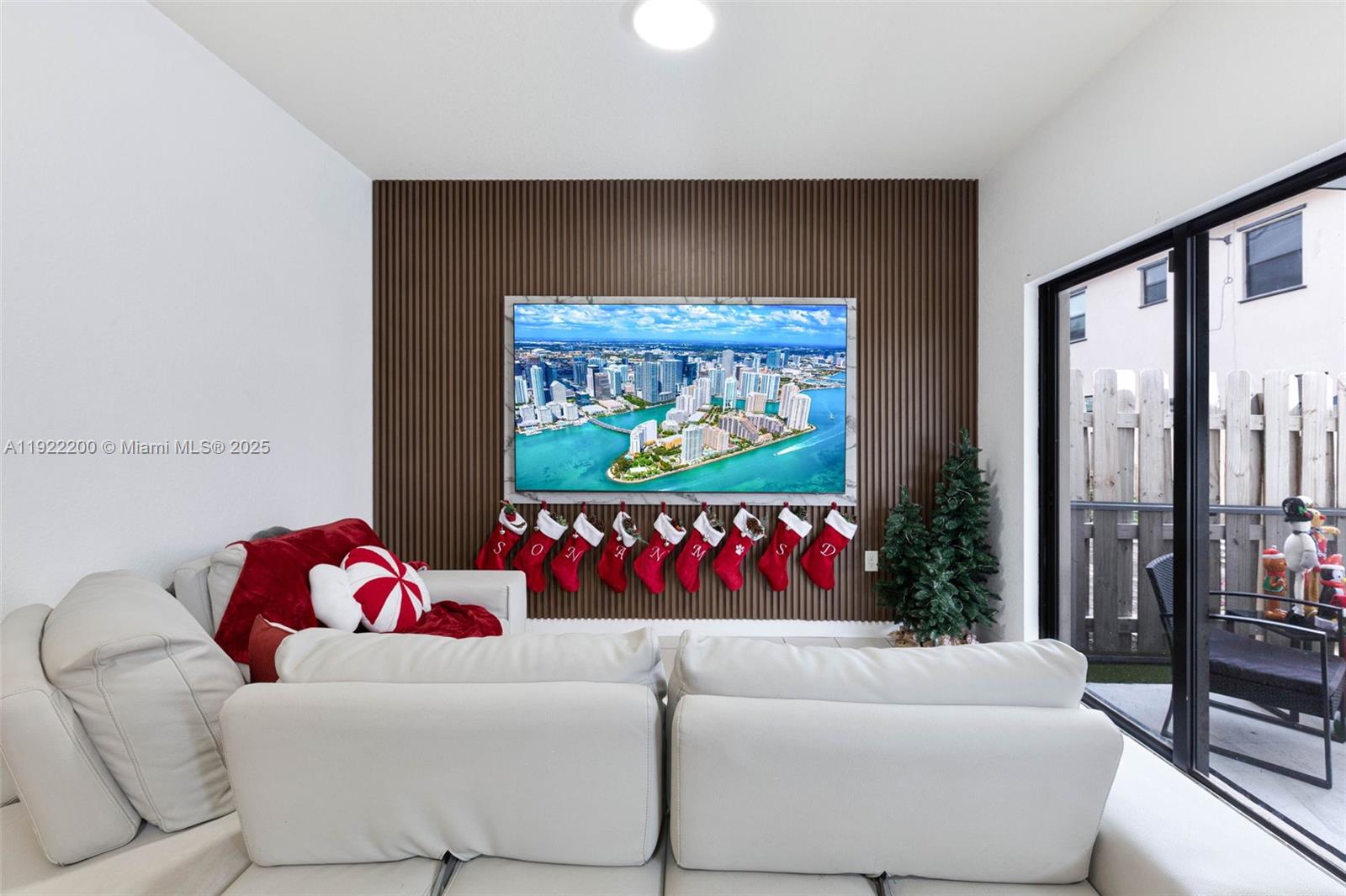 15070 Southwest 119TH Lane Miami, FL 33196 - Photo 16 of 30 a living room with couch and a floor to ceiling window