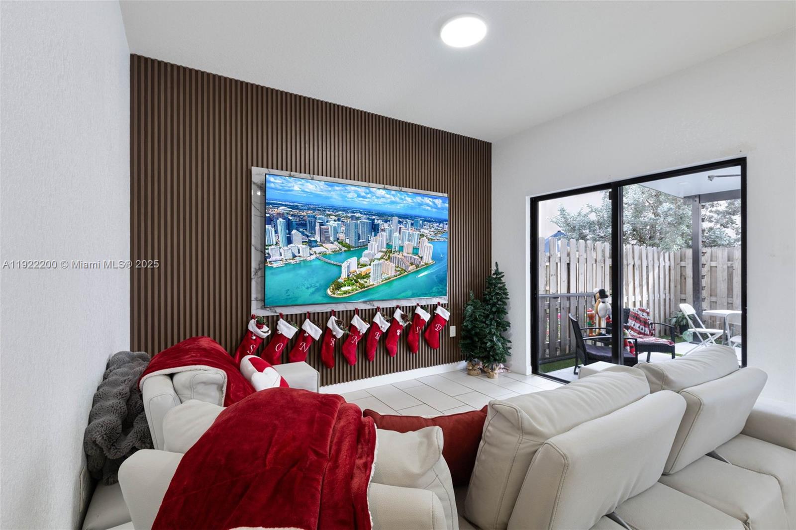 15070 Southwest 119TH Lane Miami, FL 33196 - Photo 17 of 30 a living room with furniture flowers and a large window