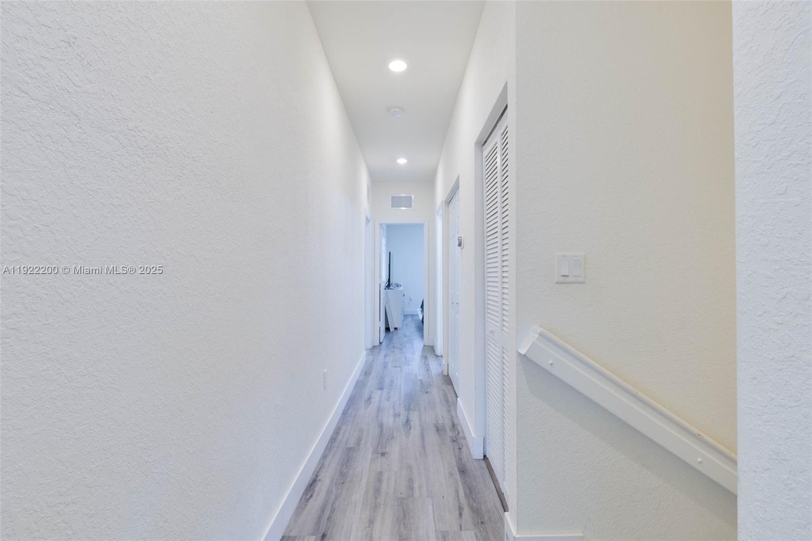15070 Southwest 119TH Lane Miami, FL 33196 - Photo 23 of 30 a view of a hallway with wooden floor