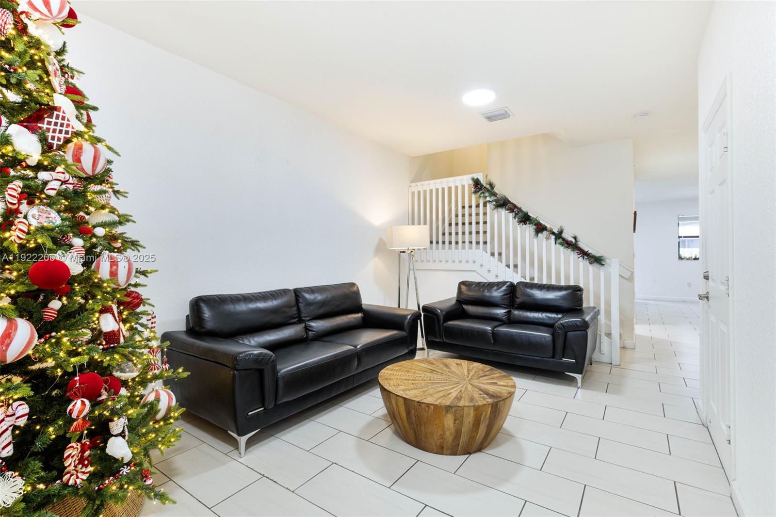 15070 Southwest 119TH Lane Miami, FL 33196 - Photo 4 of 30 a living room with furniture and flowers