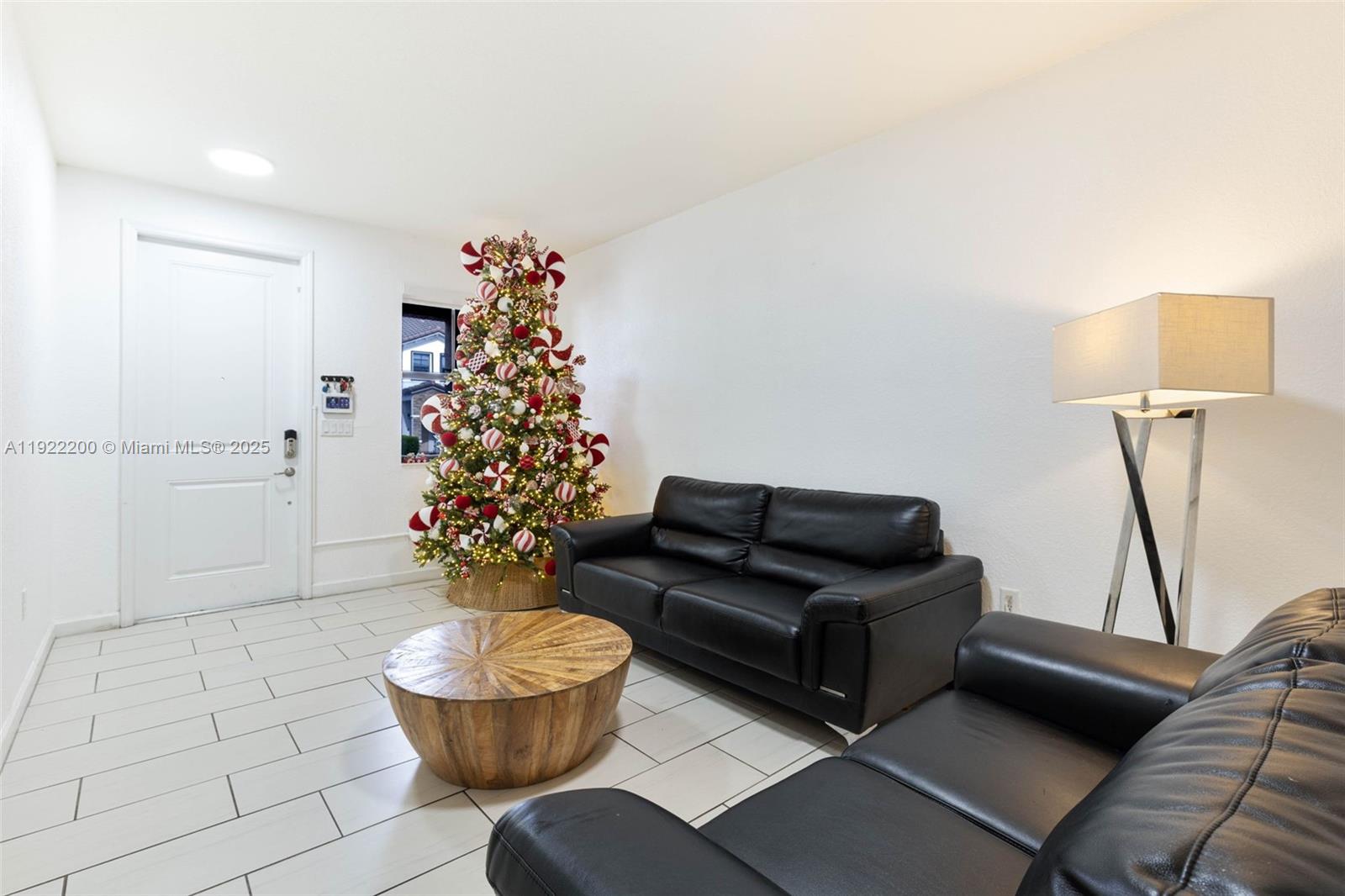 15070 Southwest 119TH Lane Miami, FL 33196 - Photo 5 of 30 a living room with furniture and a chandelier