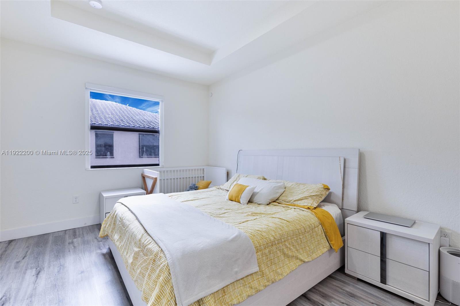 15070 Southwest 119TH Lane Miami, FL 33196 - Photo 10 of 30 a bedroom with a bed and wooden floor