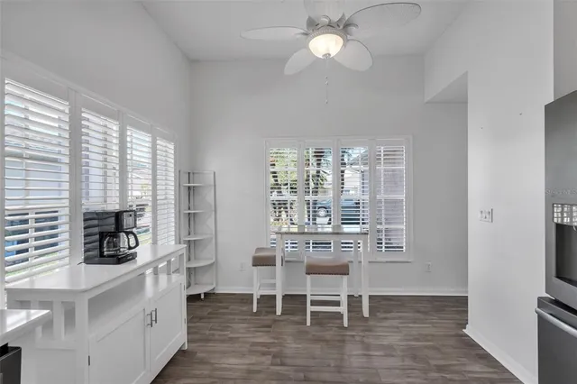a bath tub sitting in a bathroom next to a window