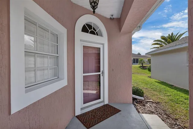 a view of a dining room with furniture wooden floor and a chandelier