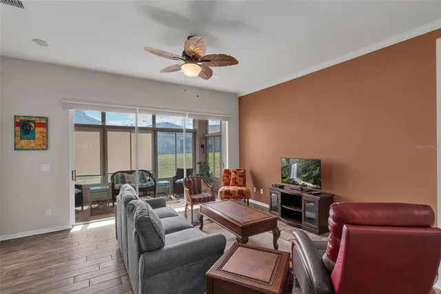 a view of a dining room with furniture wooden floor and chandelier