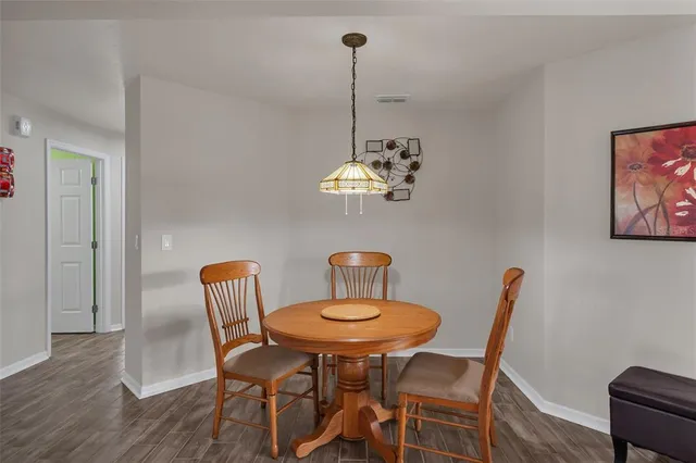 a kitchen with granite countertop cabinets stainless steel appliances and a sink