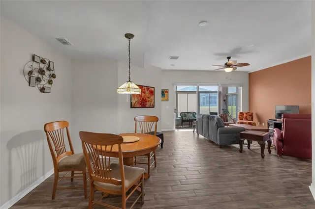 a bedroom with a bed and a lamp