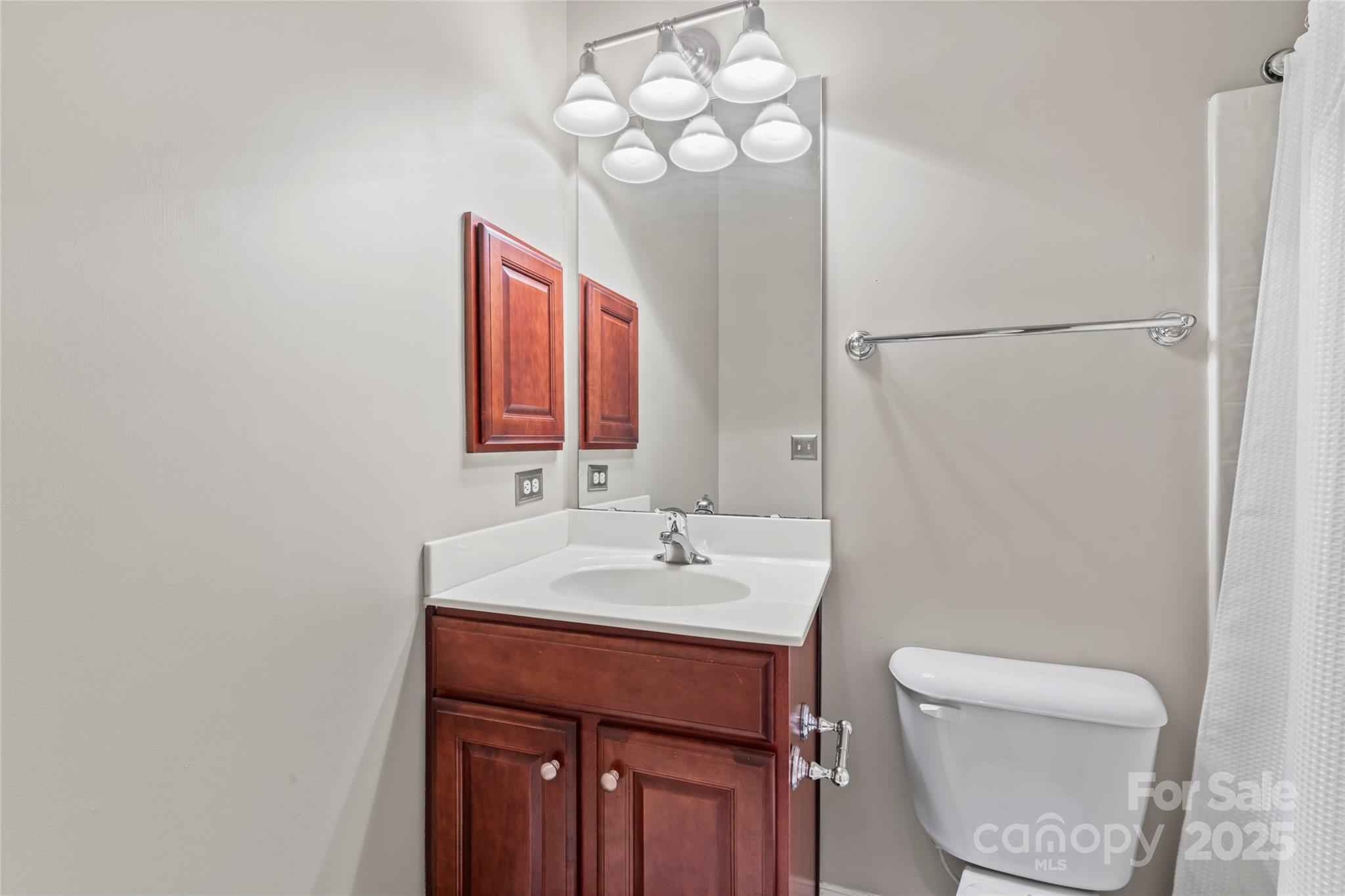 878 Promenade Walk Fort Mill, SC 29708 - Photo 33 of 48 a bathroom with a toilet sink and mirror