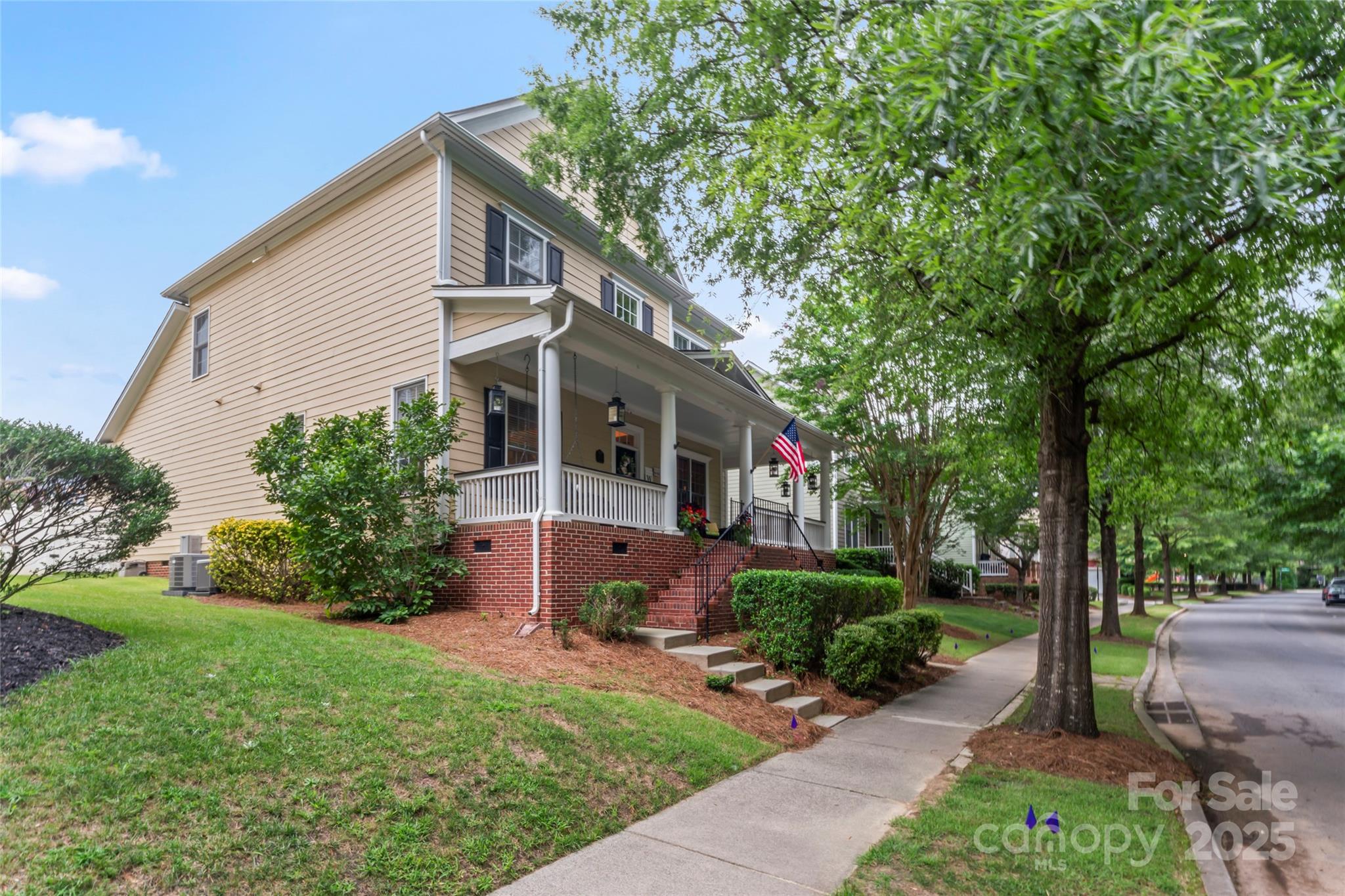 878 Promenade Walk Fort Mill, SC 29708 - Photo 46 of 48 a front view of a house with a garden