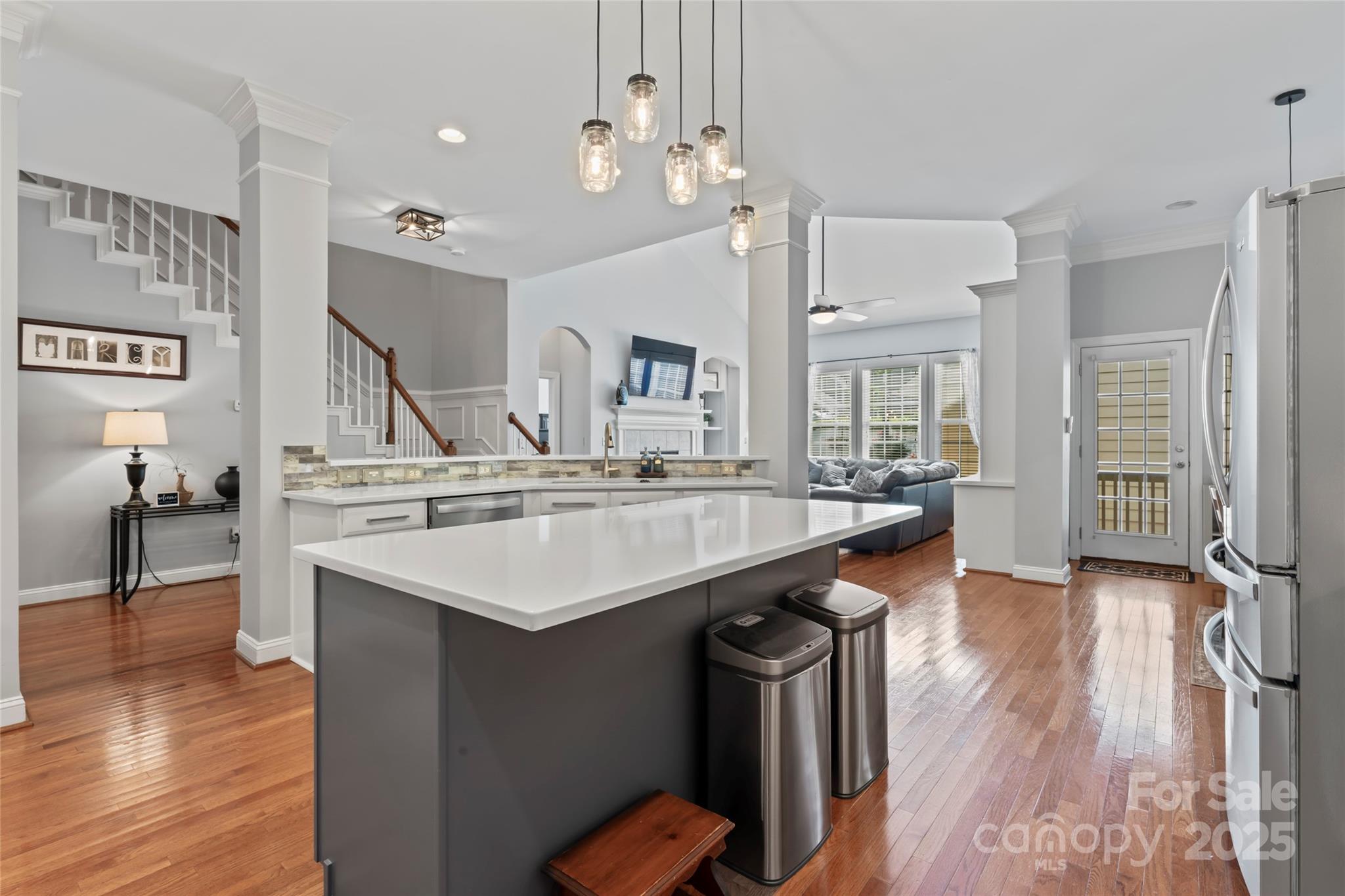 878 Promenade Walk Fort Mill, SC 29708 - Photo 6 of 48 a kitchen with counter top space appliances and wooden floor