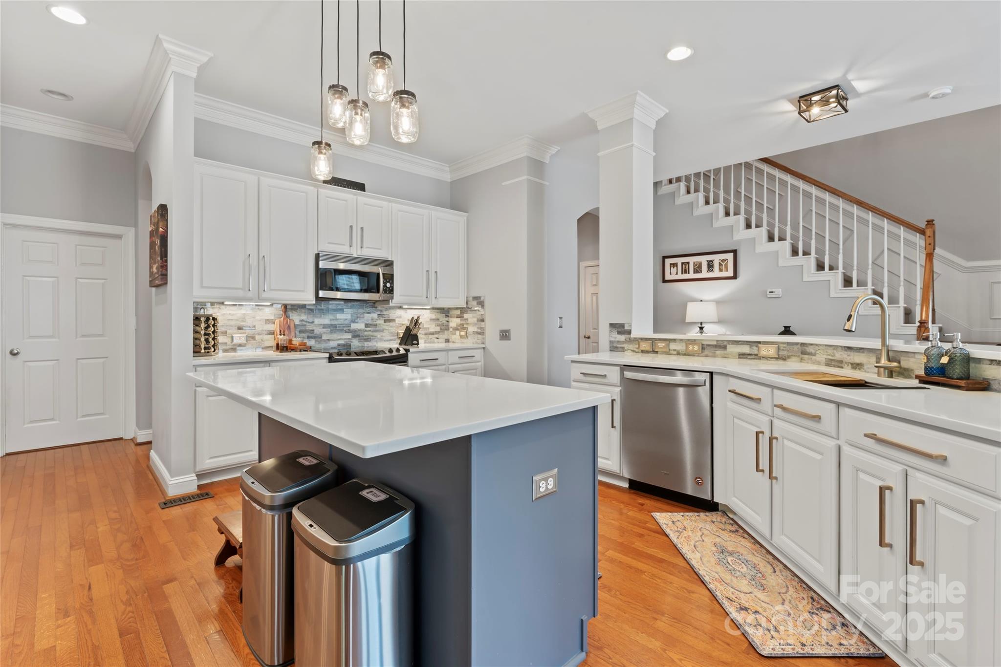 878 Promenade Walk Fort Mill, SC 29708 - Photo 8 of 48 a kitchen with granite countertop a sink appliances cabinets and a counter top space