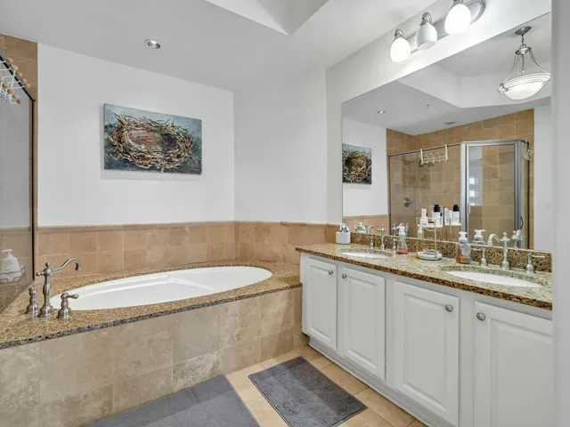 a balcony with wooden floor and outdoor seating