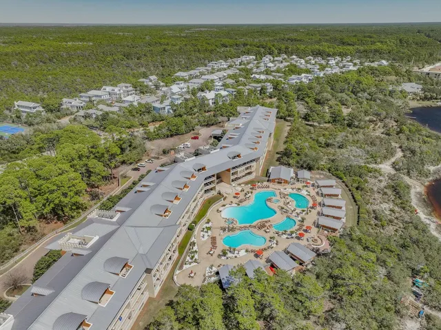 a view of a swimming pool and lounge chair